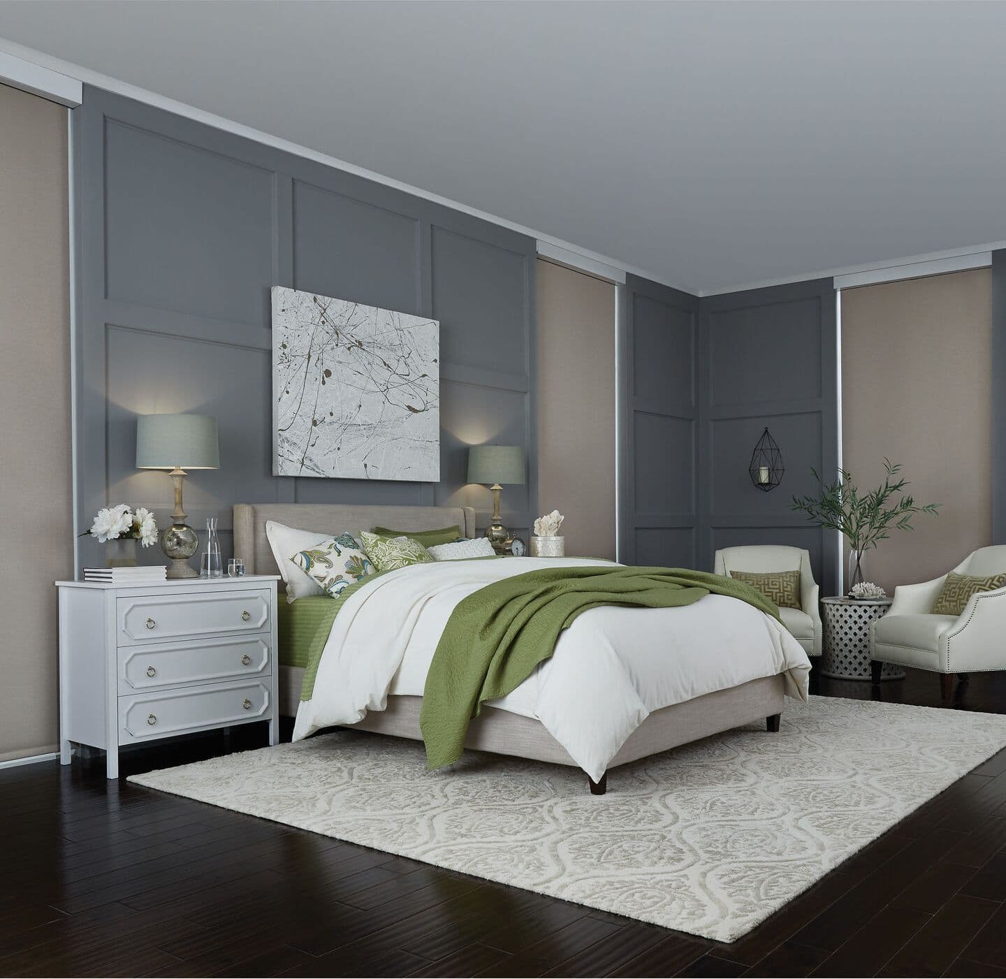 A gray paneled bedroom with roller shades lowered under white fascia covers