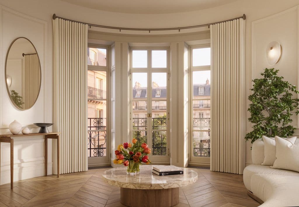 A bronze motorized curtain pole bent around a bay of tall French doors, with ripple-fold curtains